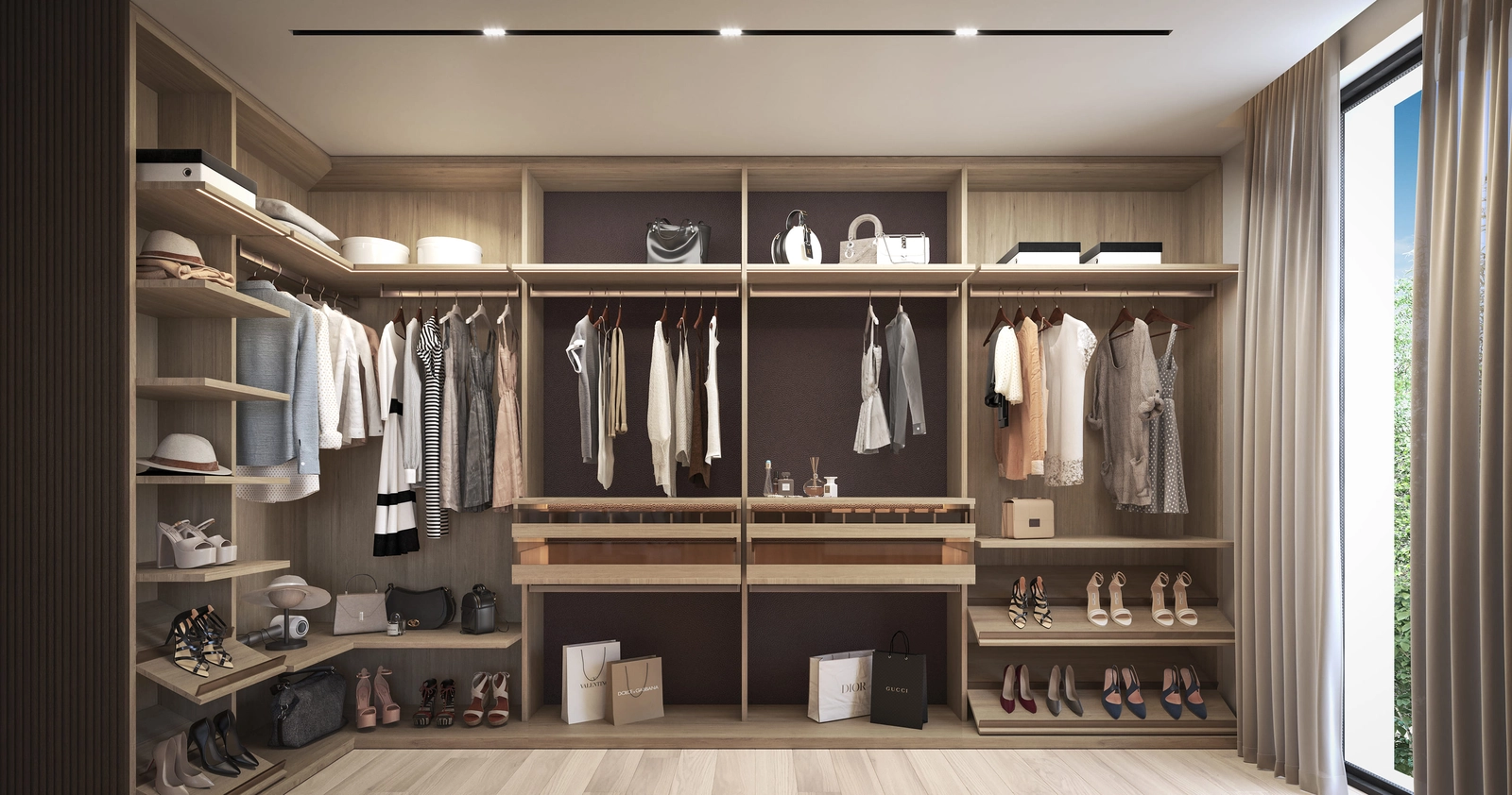 Et rummeligt og smukt designet walk-in-skab giver rigelig opbevaring i elegante omgivelser.