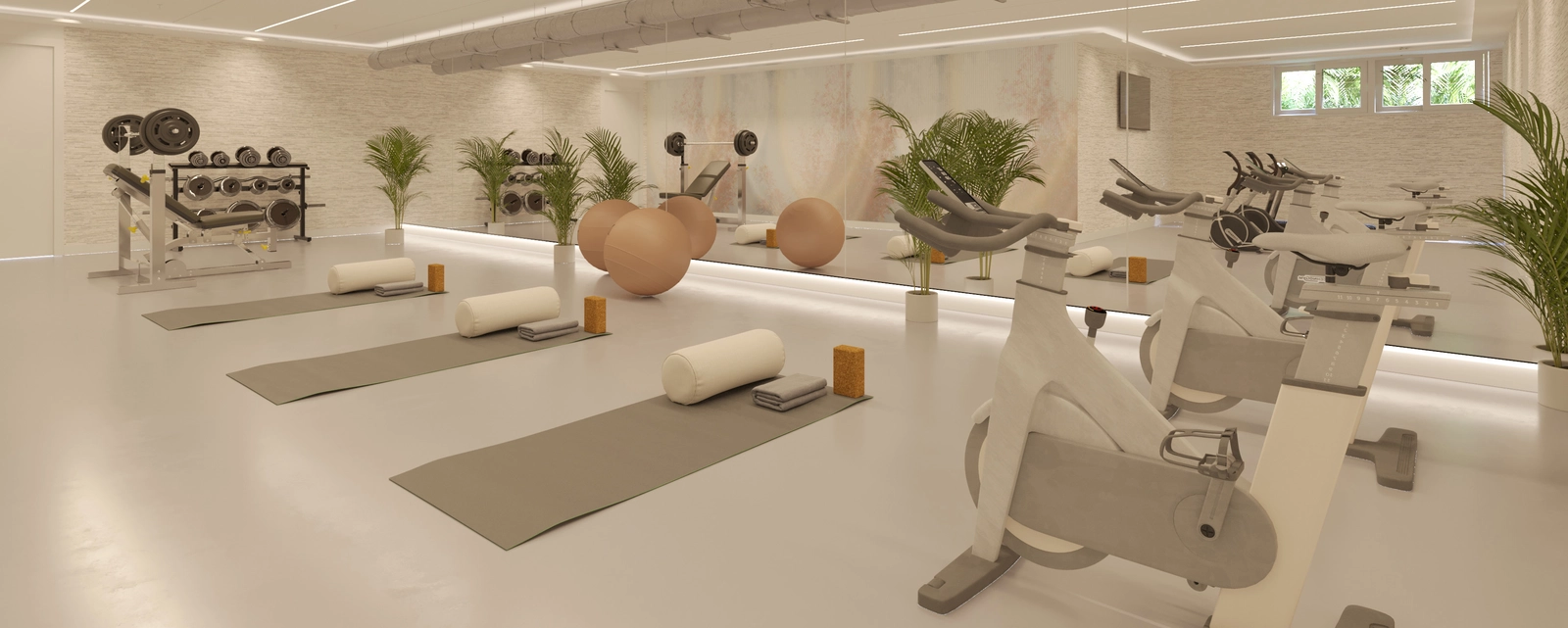 Et fuldt udstyret fitnessrum giver beboerne mulighed for at opretholde en sund livsstil uden at forlade hjemmet.