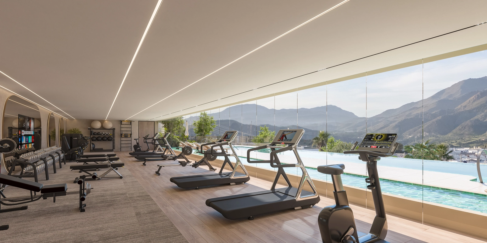 Det topmoderne fitnesscenter, fuldt udstyret og med udsigt over poolen og bjergene for en inspirerende træning.