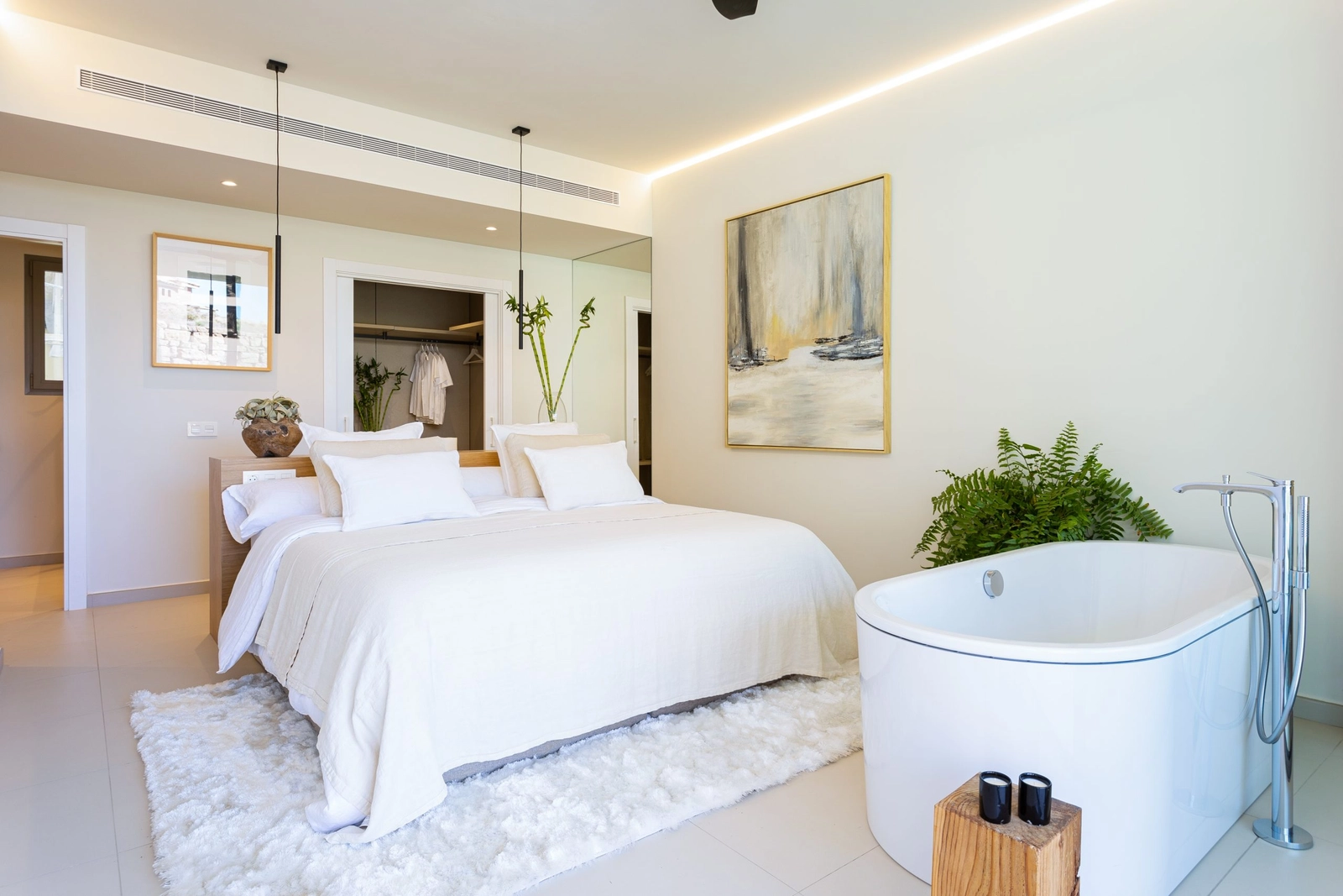 The master suite is a personal sanctuary, complete with an open-concept bathtub and direct terrace access.