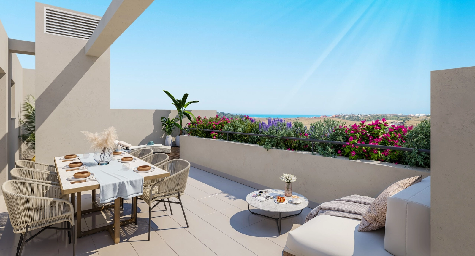 A spacious private terrace designed for dining and relaxing, with beautiful views over the Costa del Sol.
