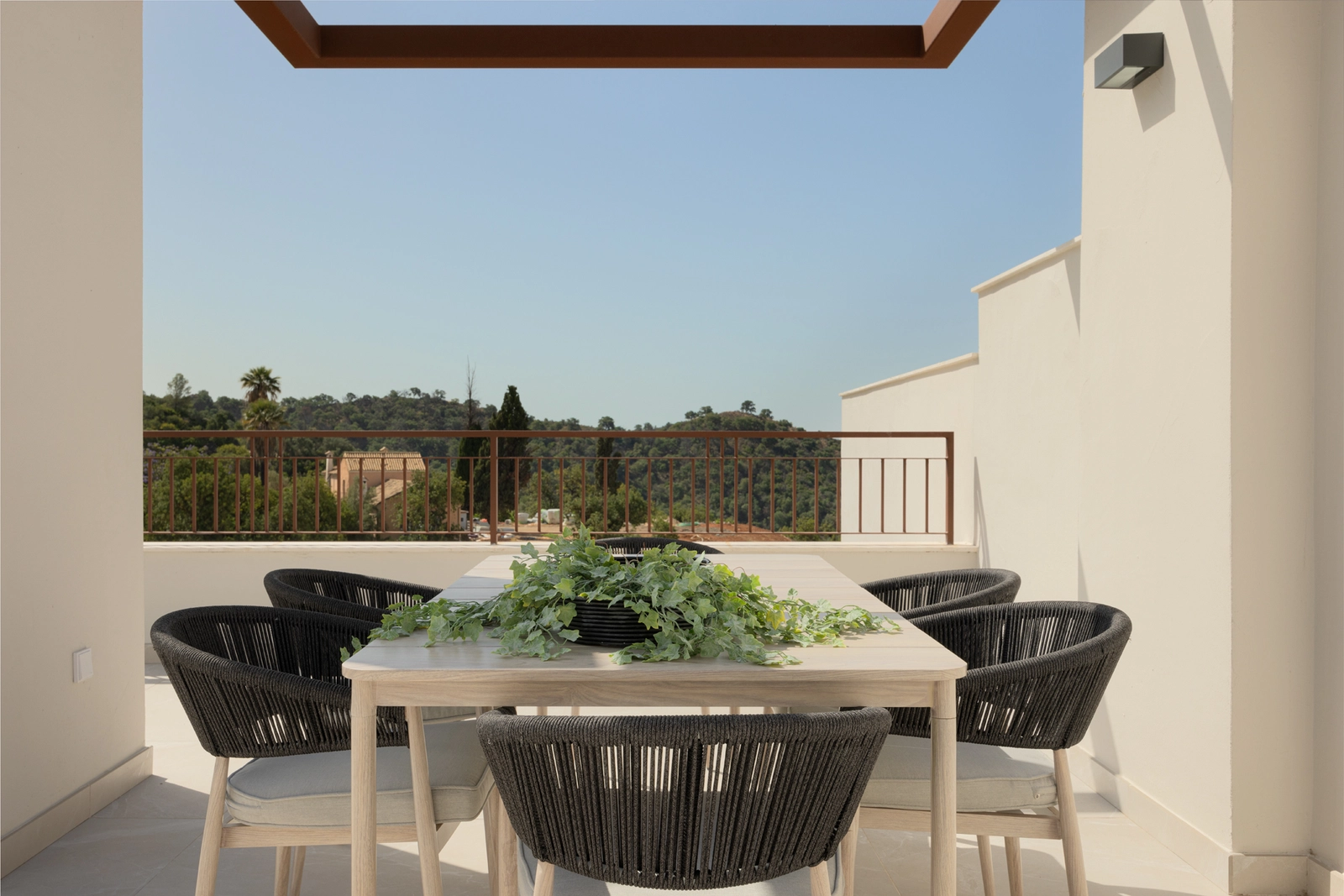 A beautifully arranged outdoor dining area, perfect for enjoying meals with a view.