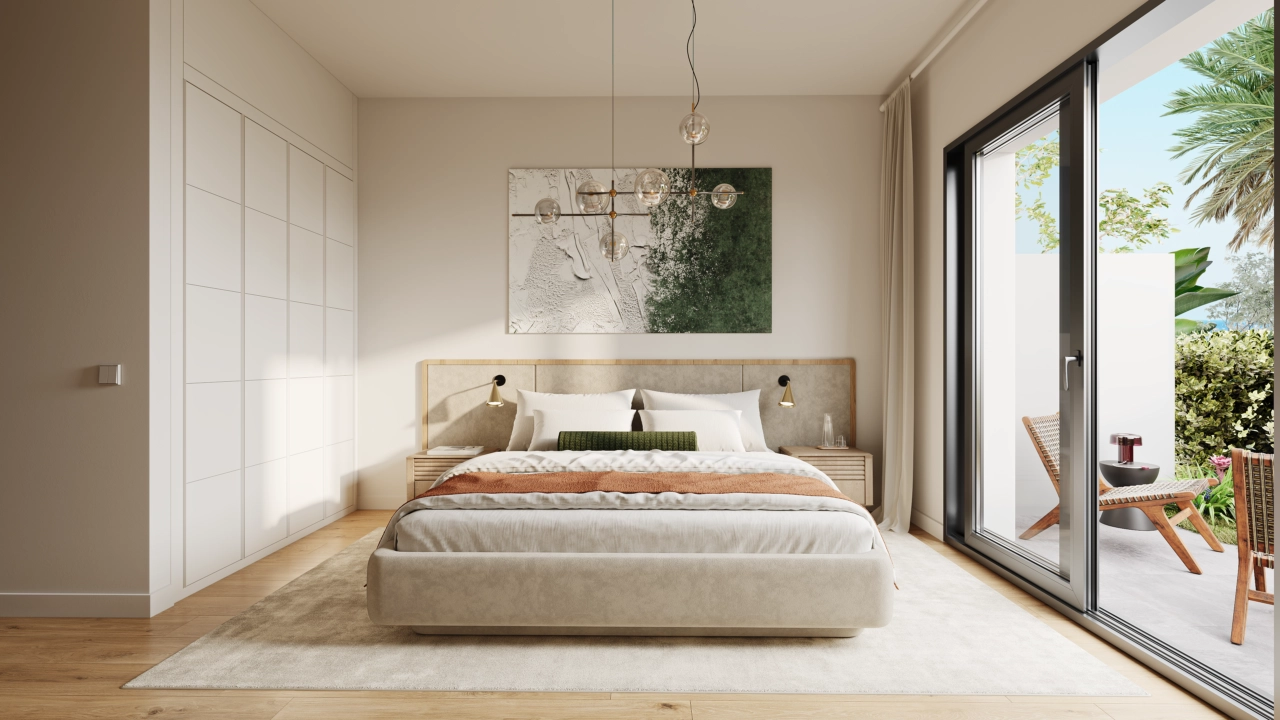 A tranquil master bedroom designed for rest and relaxation, with direct access to an outdoor space.