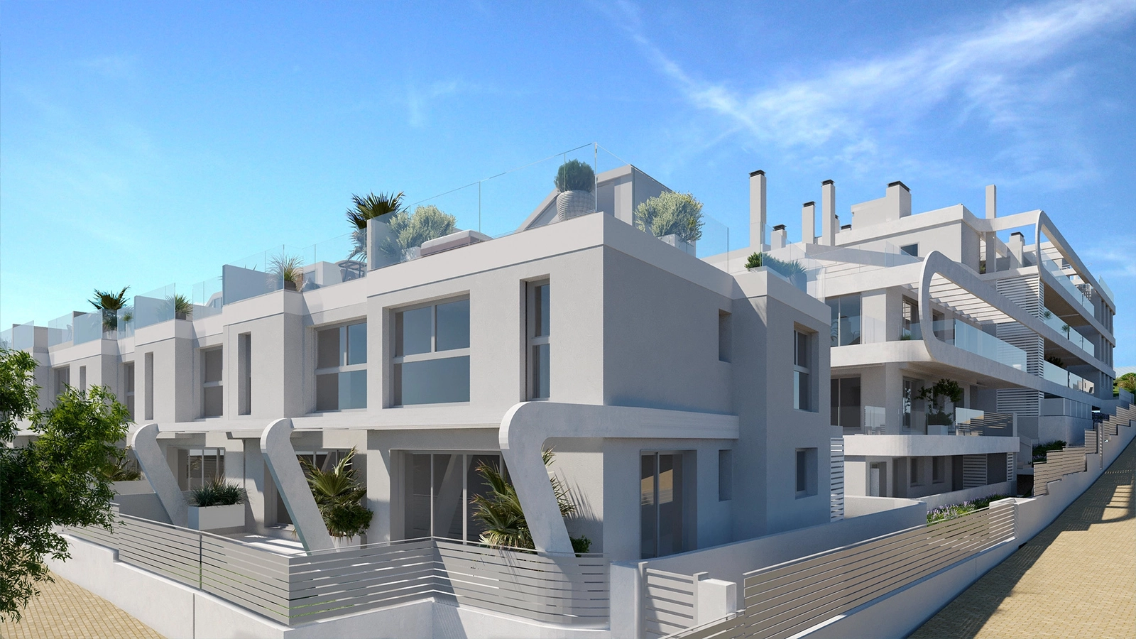 An aerial view of the development, showcasing its excellent location close to Estepona town and the sea.