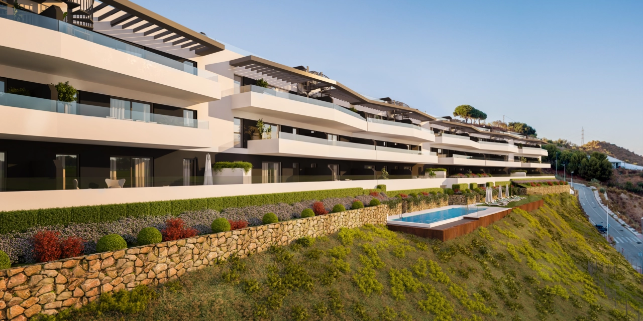 The sleek, modern architecture of the development at sunset.