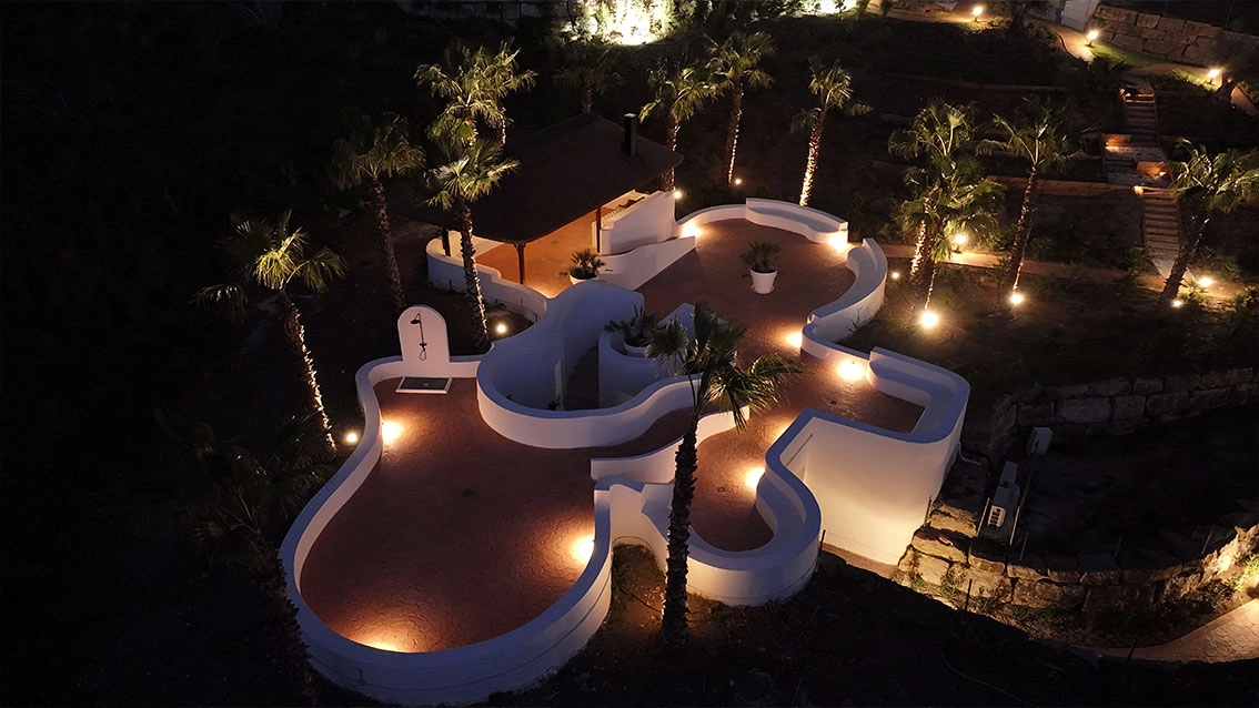 The beautifully illuminated communal grounds at night create a magical and secure atmosphere.