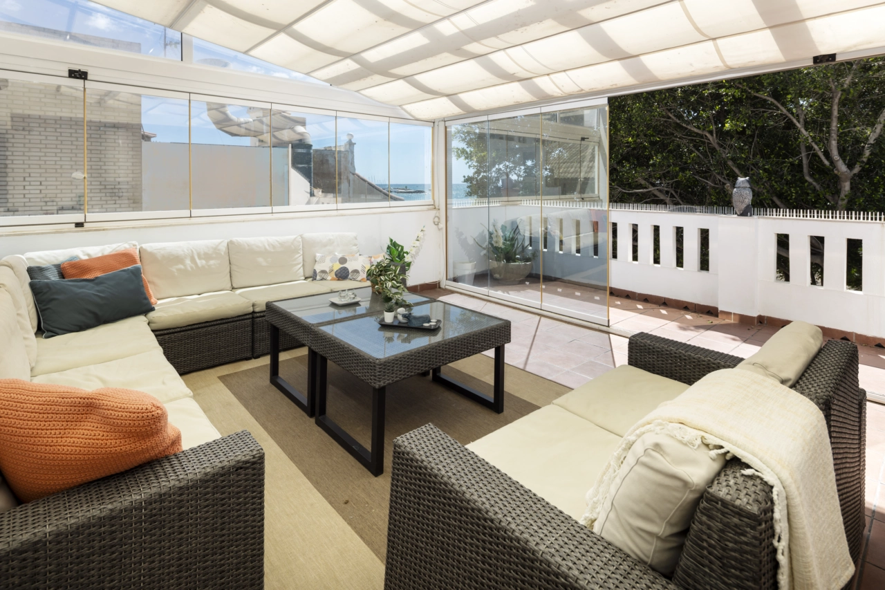 The rooftop terrace is a versatile space for relaxing, dining, and enjoying the Spanish climate.