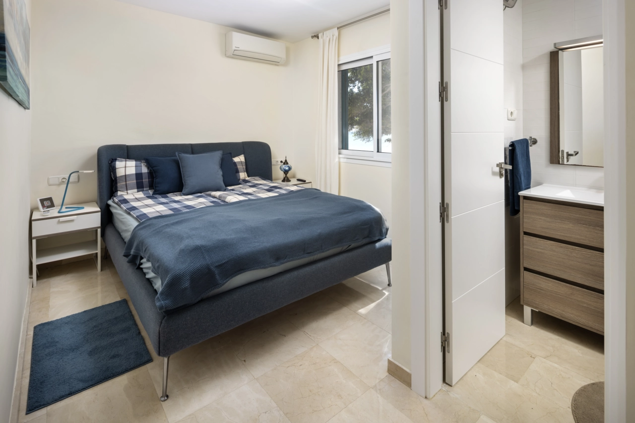 The primary bedroom offers a peaceful retreat with its own en-suite bathroom.