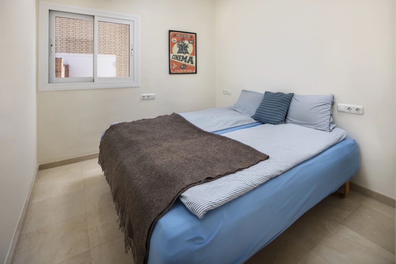 A comfortable guest bedroom, well-proportioned and designed for relaxation.