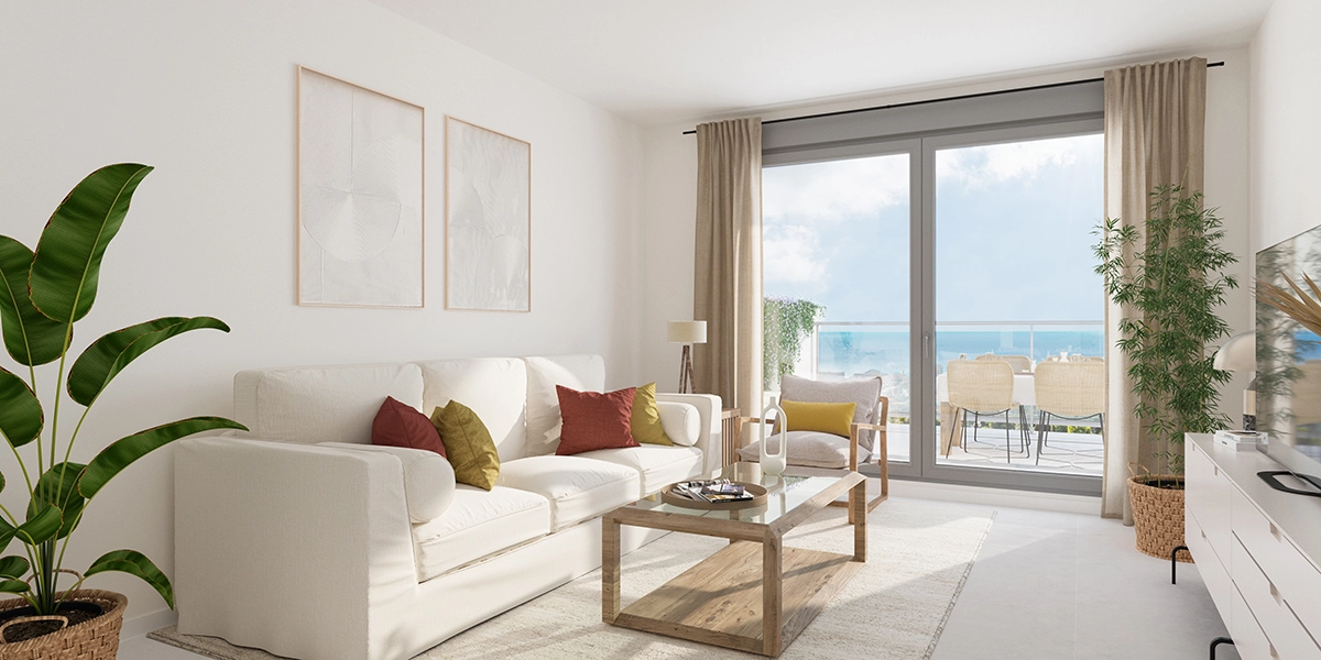 A bright and inviting living room designed for comfort, opening directly onto the terrace.