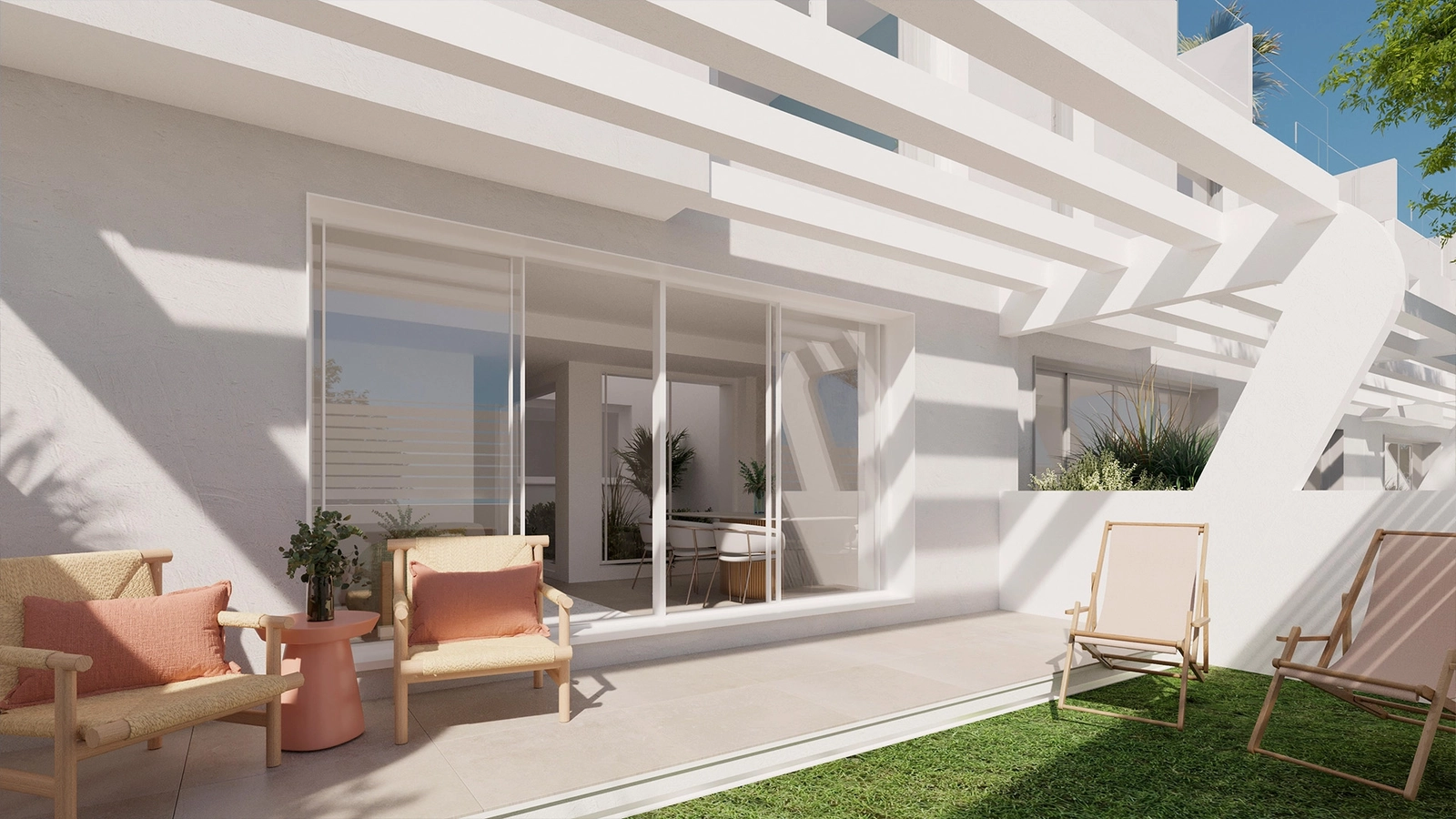 Bright and open living spaces flow seamlessly onto a terrace with beautiful views towards the sea.