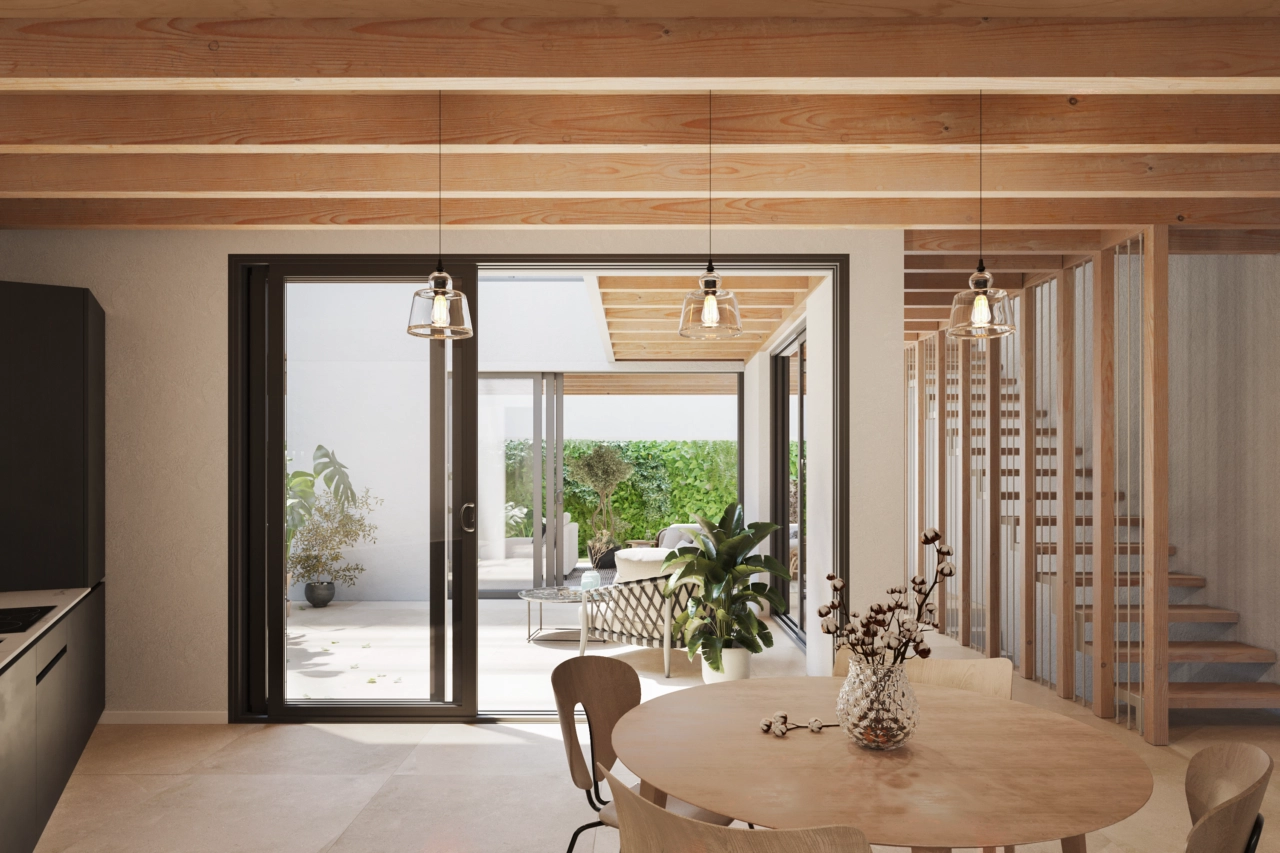 The dining area flows seamlessly towards the patio, creating a large, connected living space.