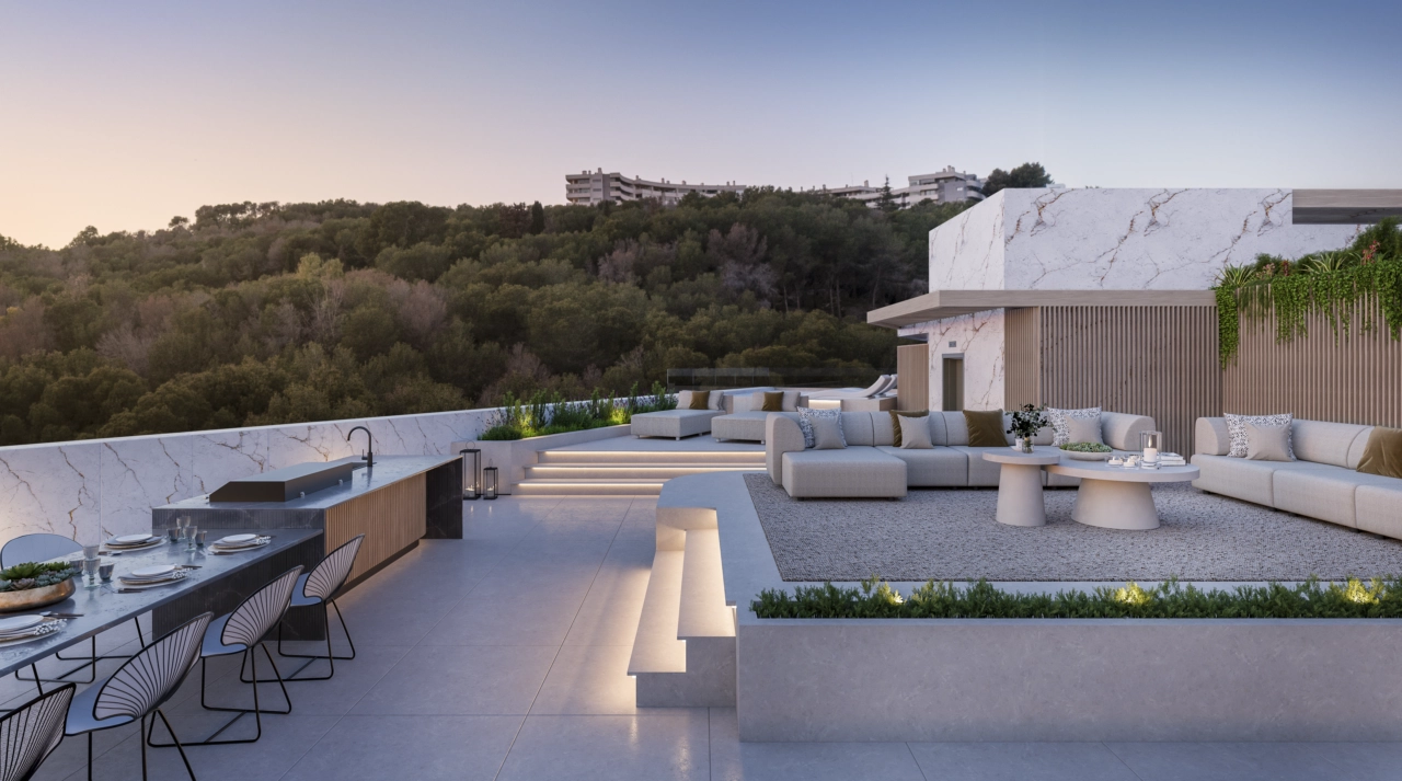 The expansive rooftop terrace includes an outdoor kitchen, perfect for entertaining guests with a backdrop of the Costa del Sol.