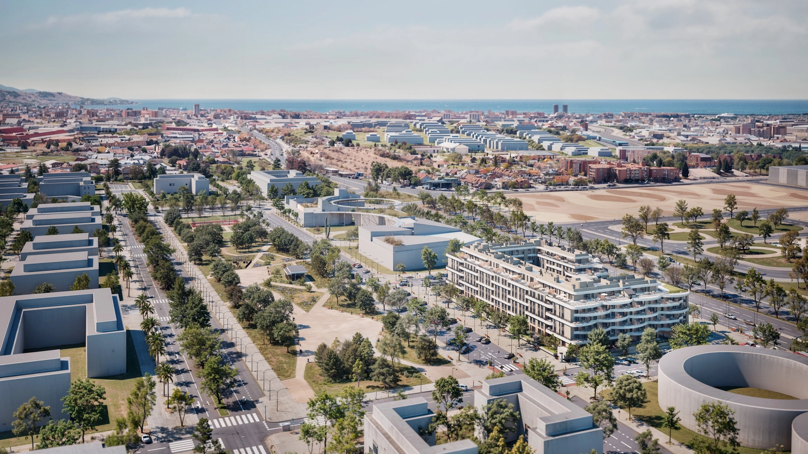 An elevated view of the development, showcasing its integration into the expanding Malaga cityscape with the Mediterranean Sea in the distance.