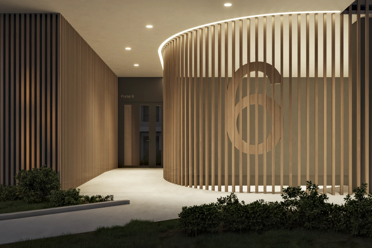 The stylish entrance lobby at dusk, featuring contemporary wood paneling and ambient lighting, creating a warm welcome.