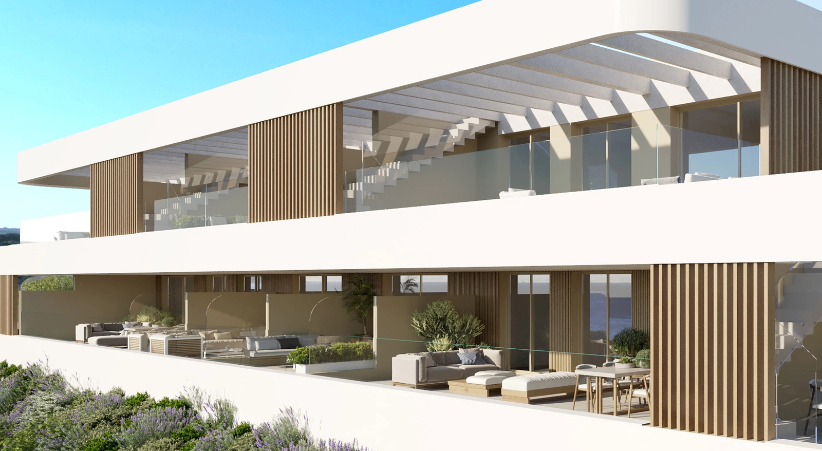 The modern facade showcases the clean design and spacious terraces of these exclusive Estepona homes.