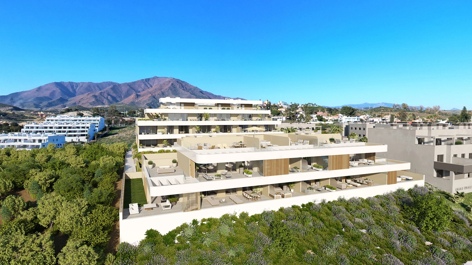 An aerial view of Celestia Homes, a modern development set against the beautiful mountain landscape of Estepona.