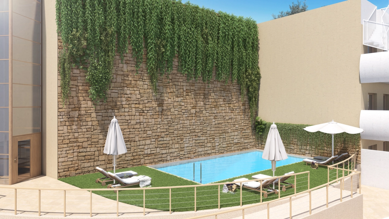 One of the two inviting outdoor swimming pools, set within beautifully landscaped communal gardens.