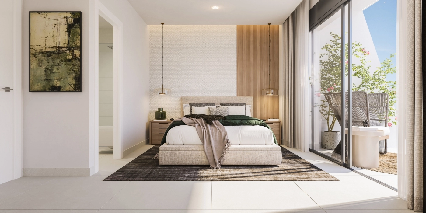 The master bedroom is a peaceful retreat, filled with natural light and offering direct access to an outdoor terrace.