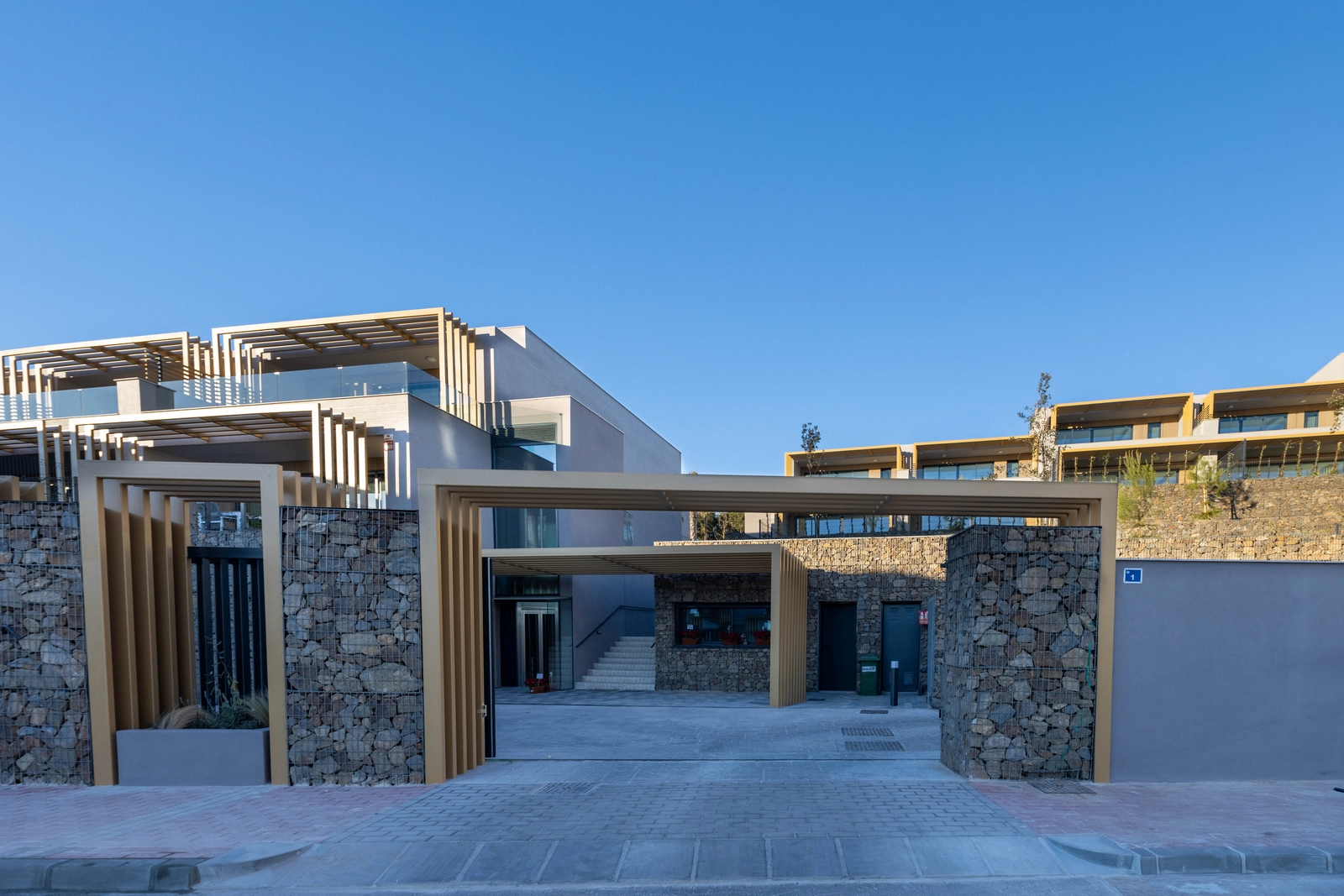 The secure and stylish entrance to the Evergreen Homes residential complex.