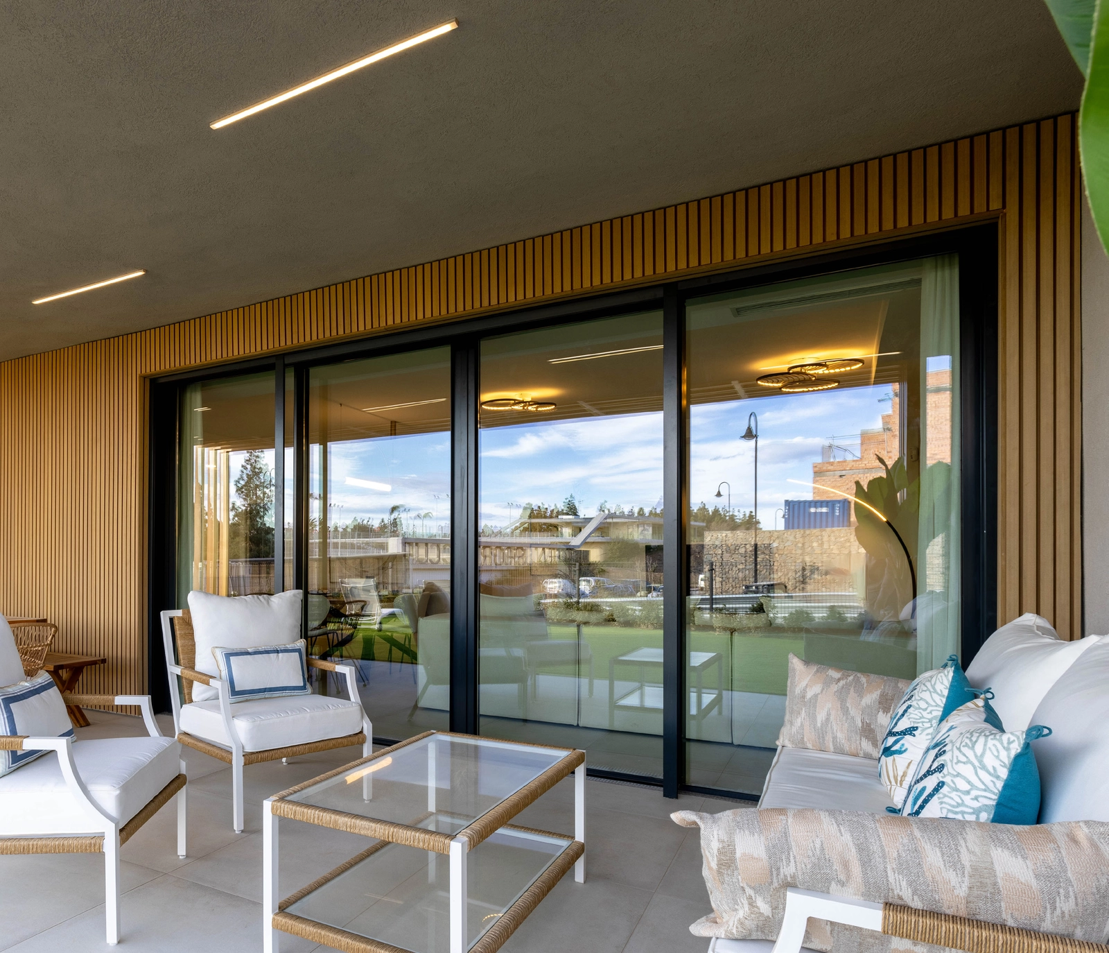 A private, covered terrace provides a tranquil space for relaxing and dining outdoors.