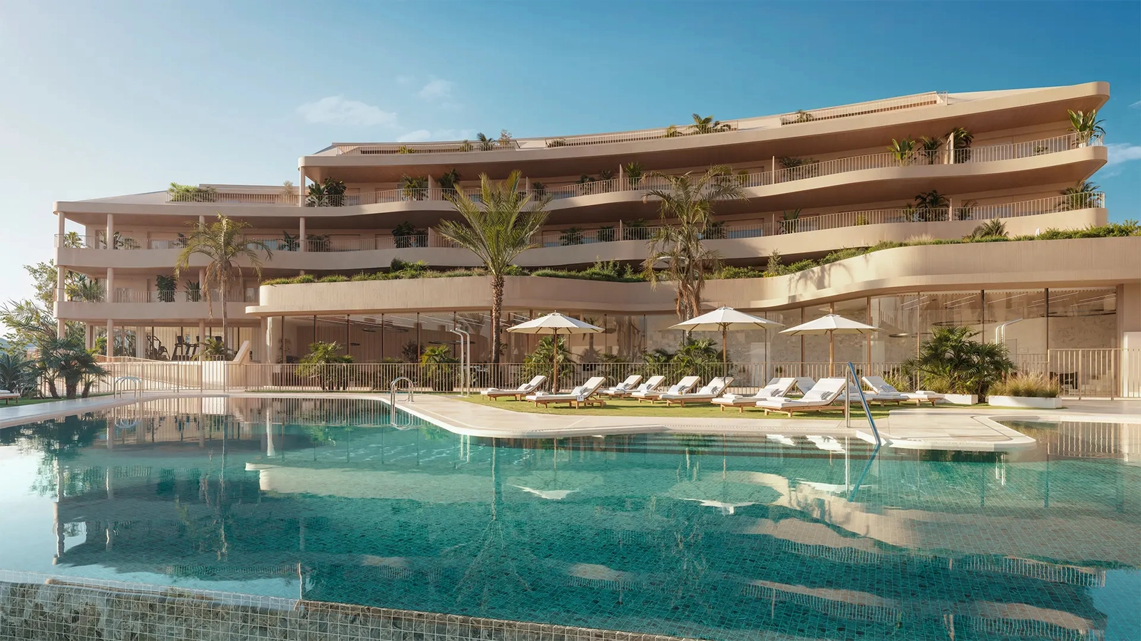 Resort-style pool and sun deck surrounded by Mediterranean gardens.
