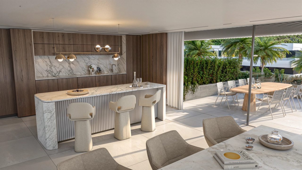A modern, high-end kitchen with a central island seamlessly connects to the dining area, ideal for social gatherings.