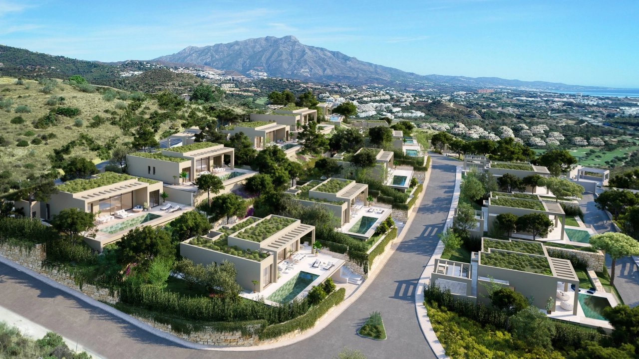 An aerial view of the development, showcasing its integration with the beautiful natural landscape of Benahavís.