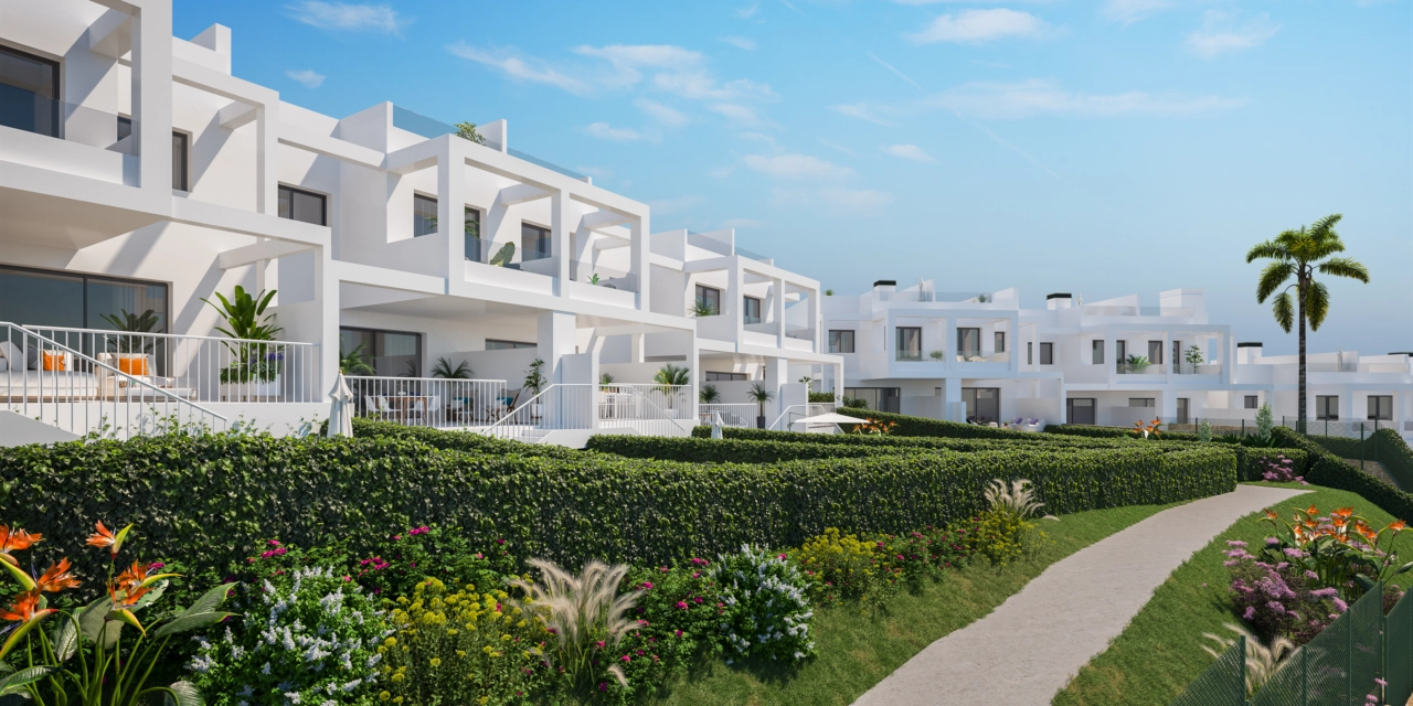 Manicured gardens and pathways wind through the development, offering beautiful and peaceful surroundings.
