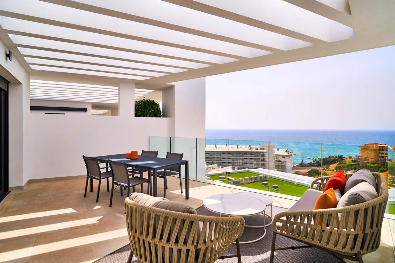 A spacious private terrace offering stunning sea views, an ideal setting for dining and relaxing outdoors on the Costa del Sol.