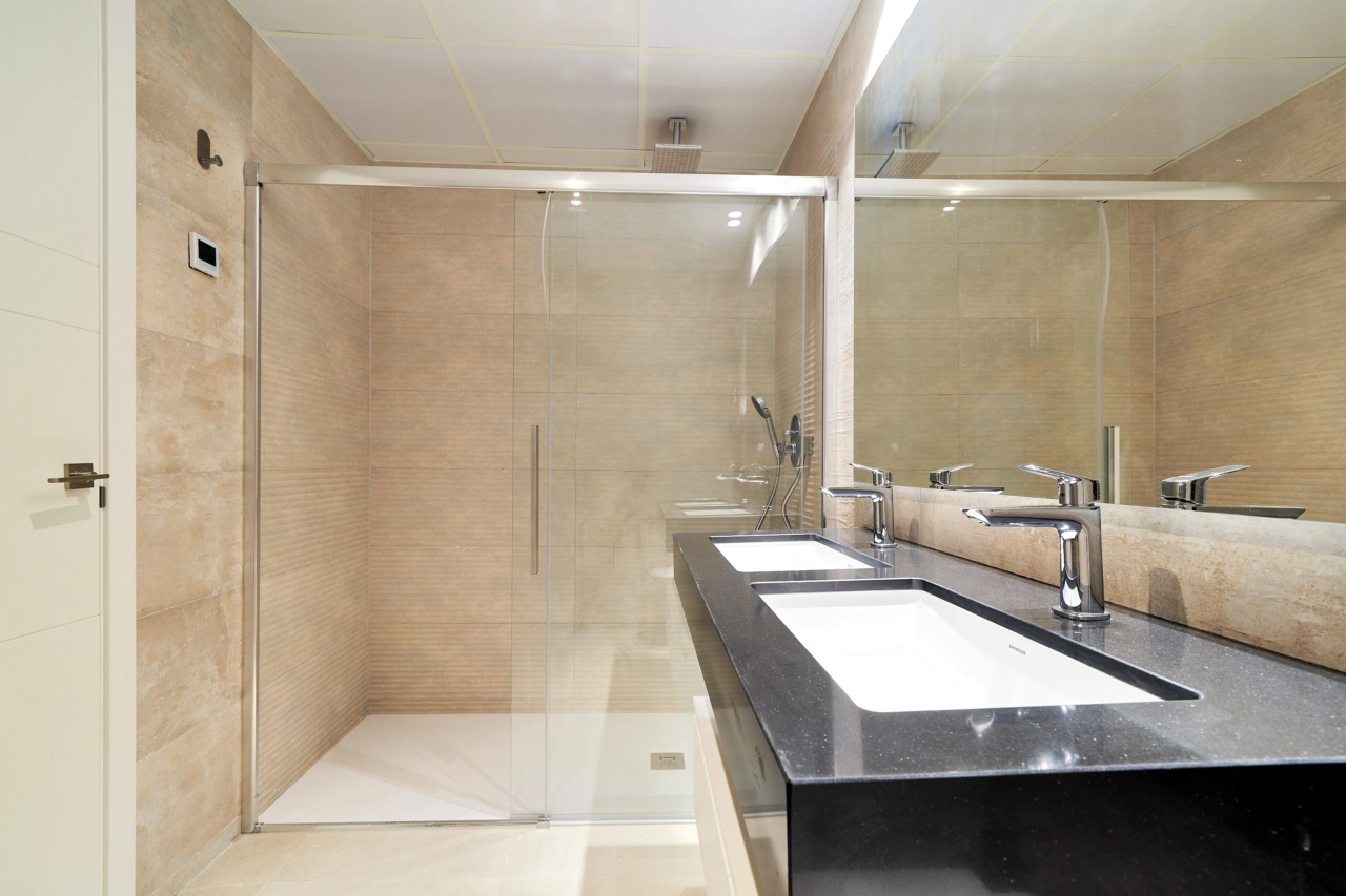 A contemporary bathroom featuring a walk-in shower and premium fittings for a spa-like experience.