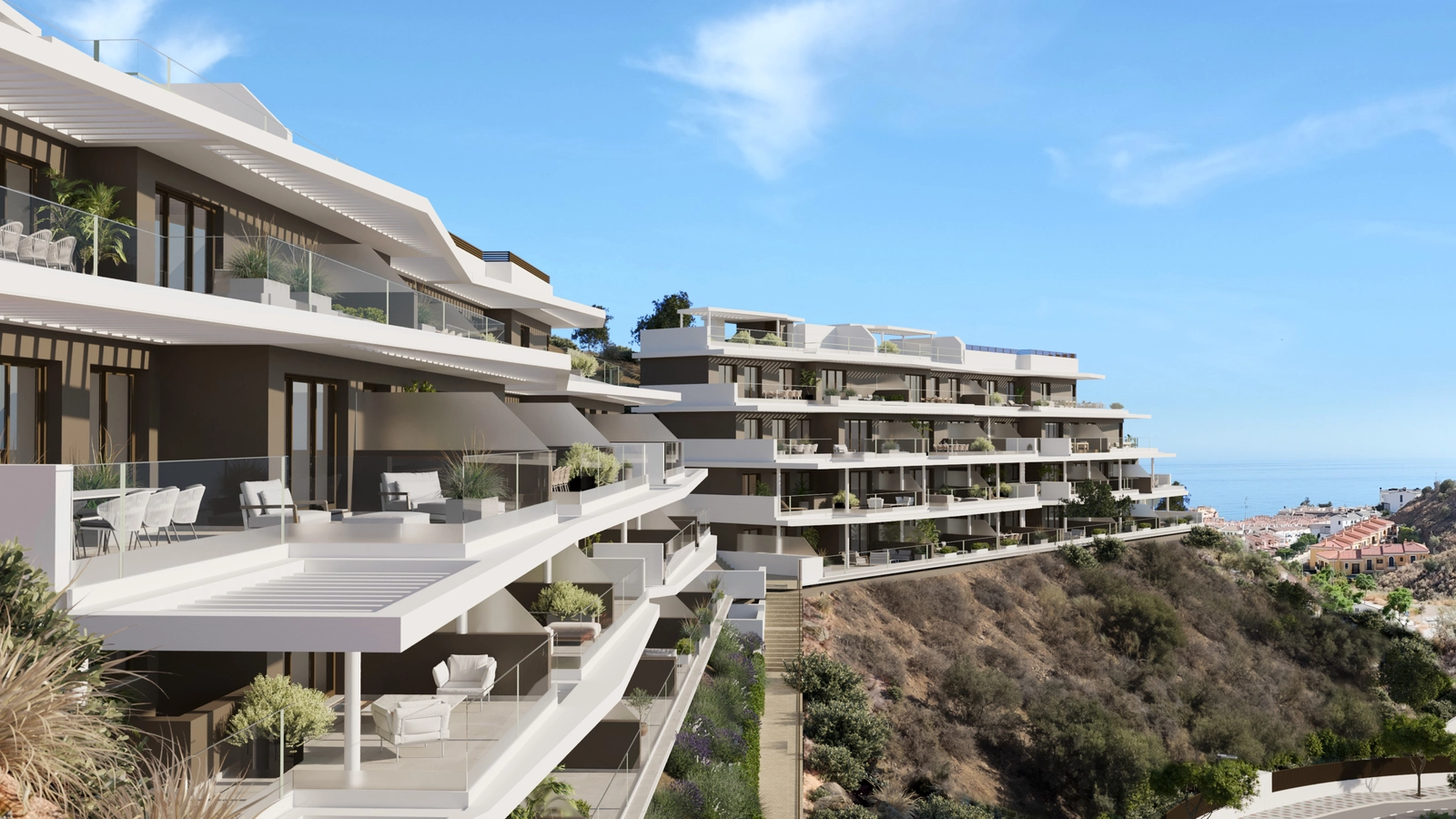 The development's modern architecture blends beautifully with the natural hillside setting.