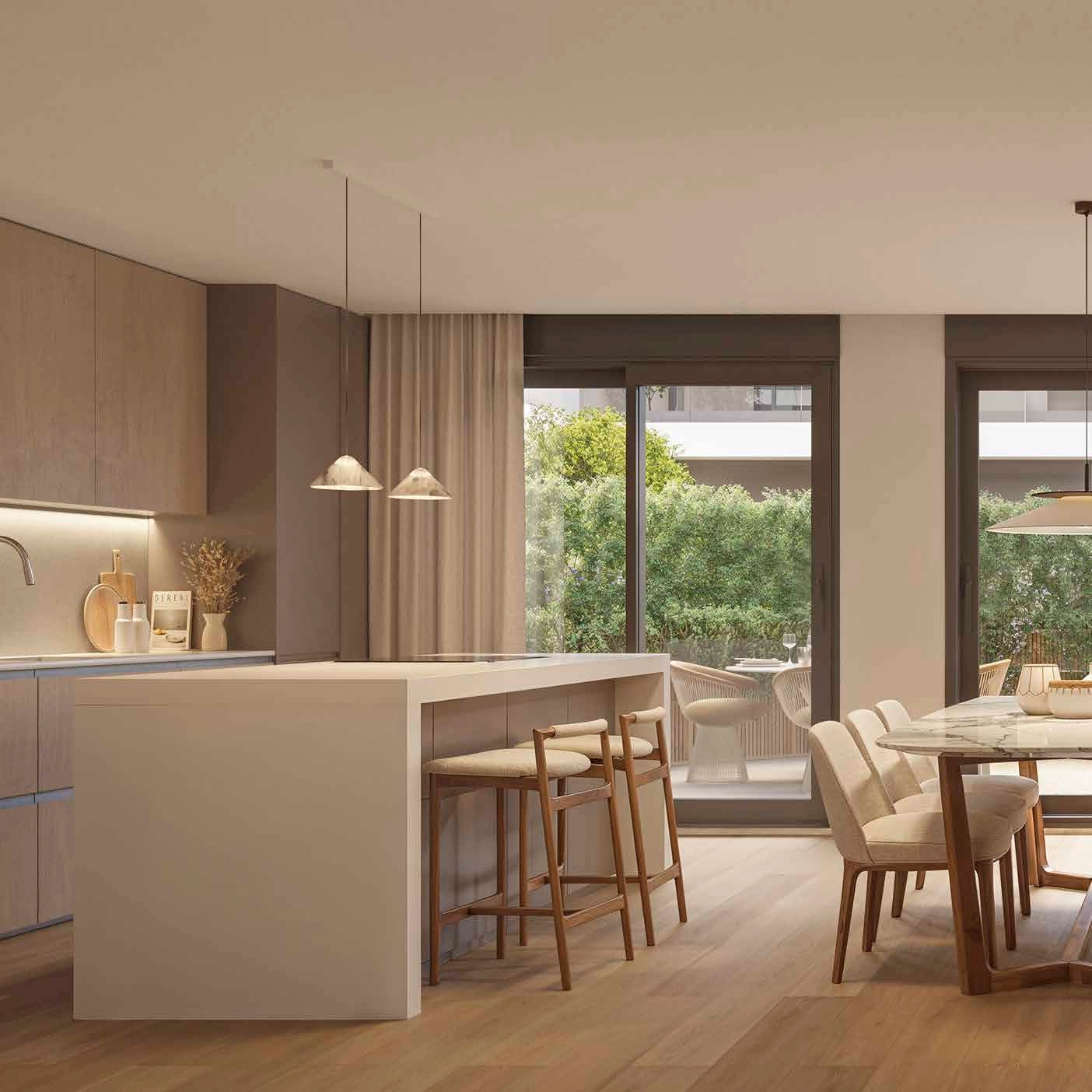 A modern, high-quality kitchen that opens into the dining area, perfect for entertaining guests.