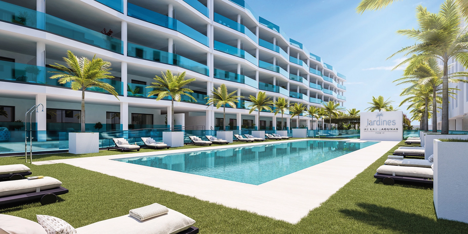 The inviting communal swimming pool, surrounded by manicured lawns for relaxation and enjoyment.
