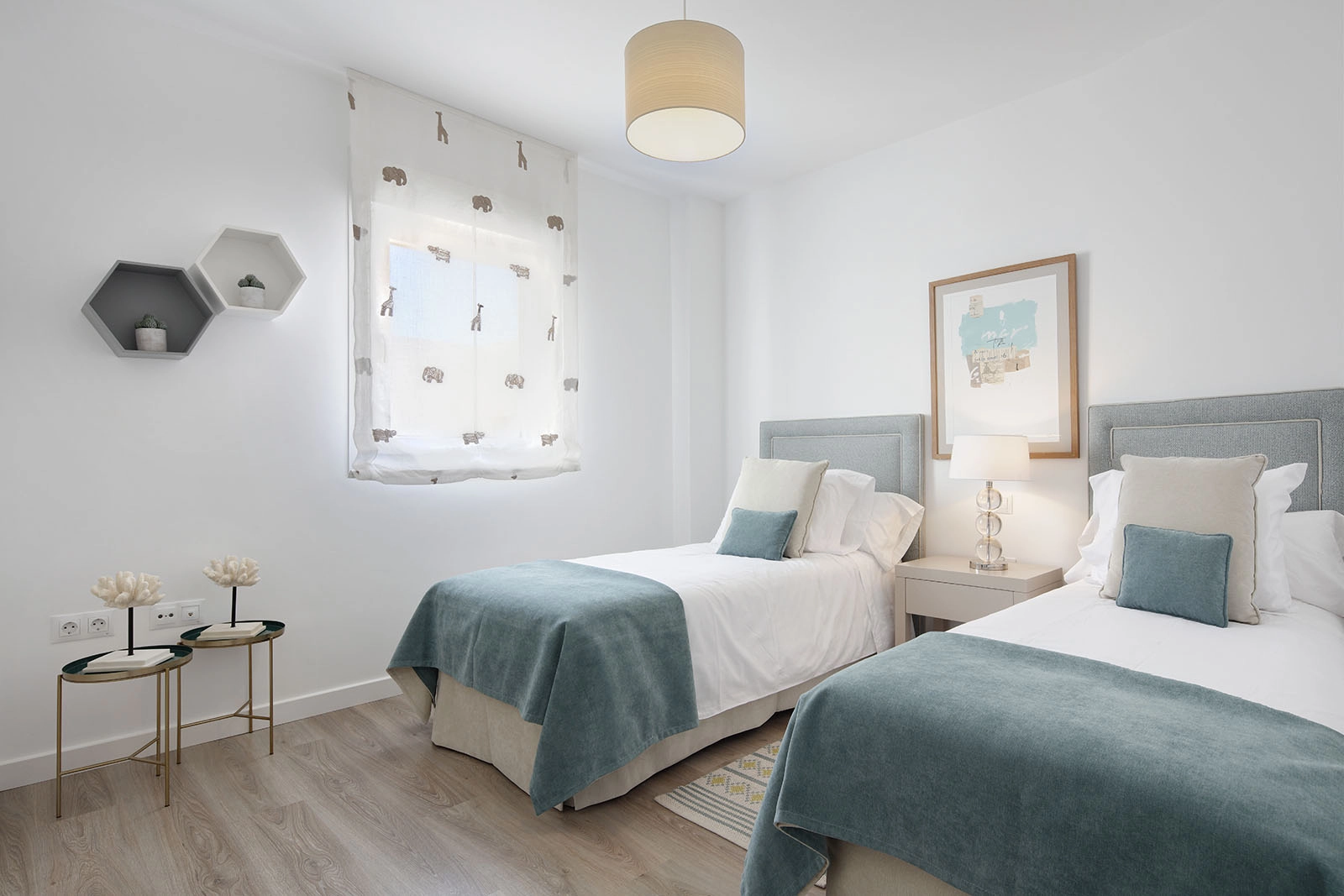 Comfortable and light-filled guest bedrooms offer a welcoming space for family and friends.