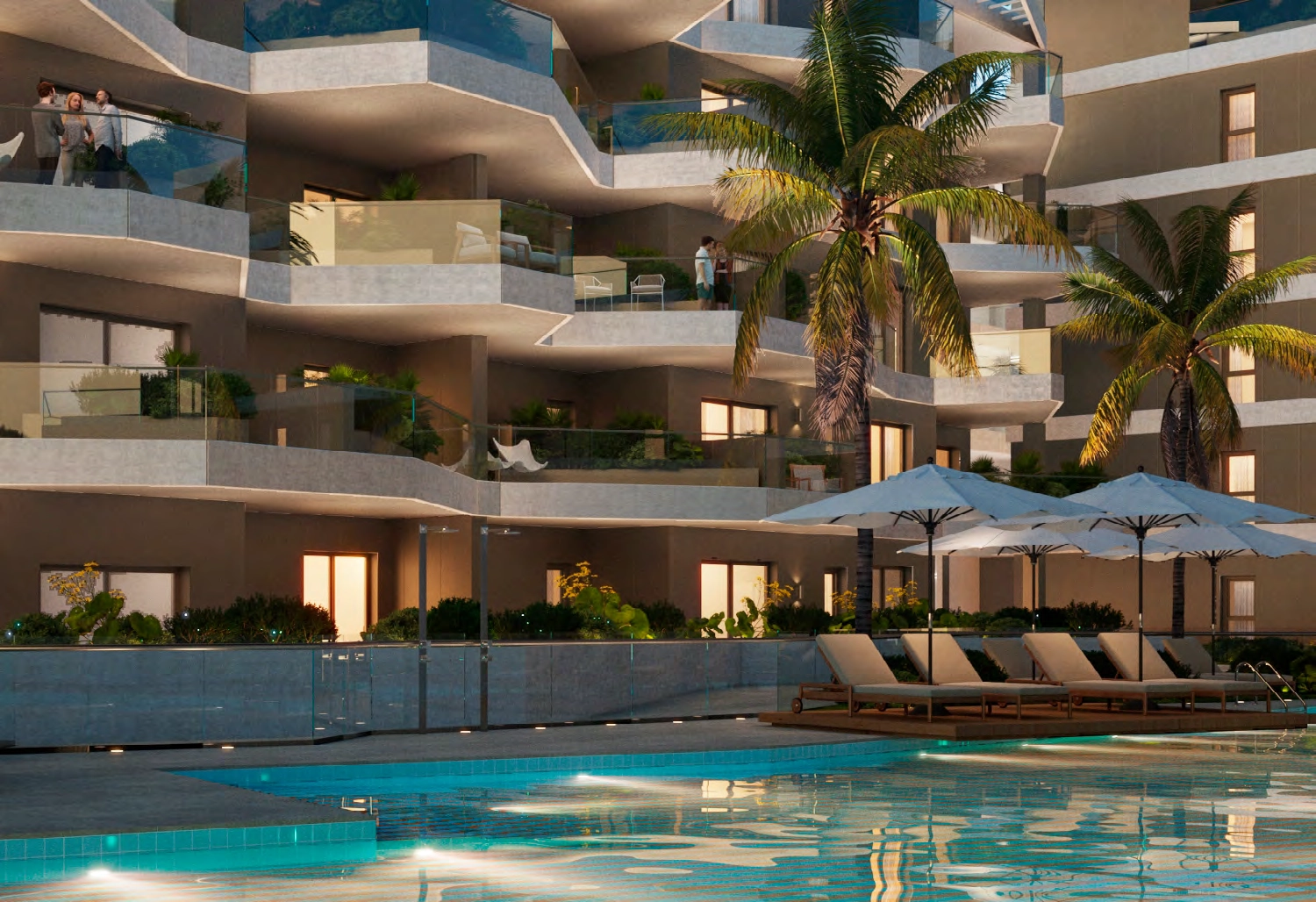 Lounge by one of the stunning outdoor pools, surrounded by immaculate landscaping and the signature architecture of the development.
