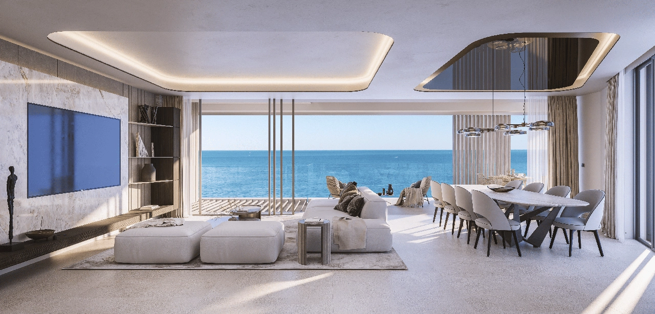The open-plan living area is designed for comfort, with large windows framing the stunning sea views.