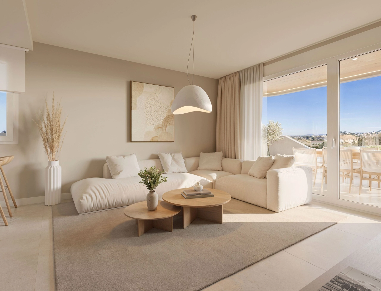 The living room is filled with natural light, creating a bright and welcoming atmosphere.