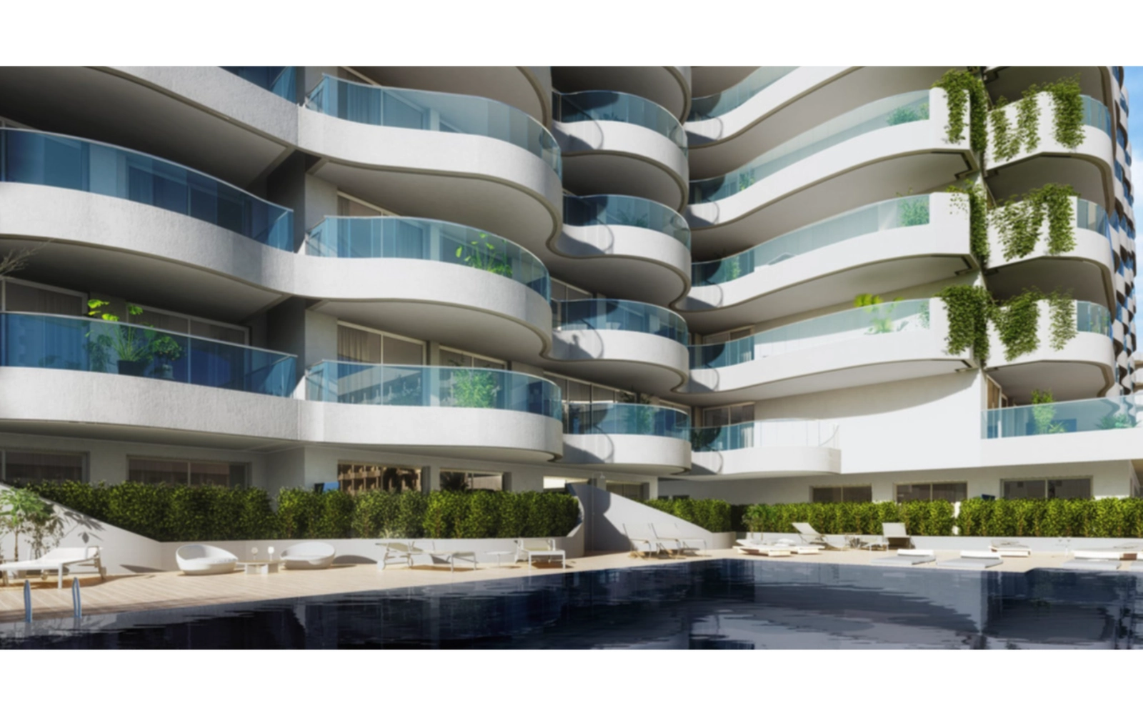 Enjoy the inviting swimming pool, surrounded by the building's unique modern architecture.