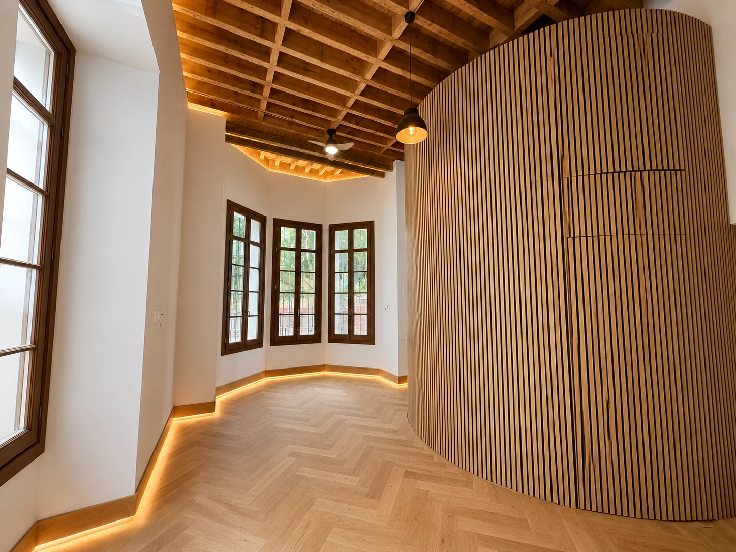 Elegant living spaces feature large, restored windows that fill the rooms with natural light.