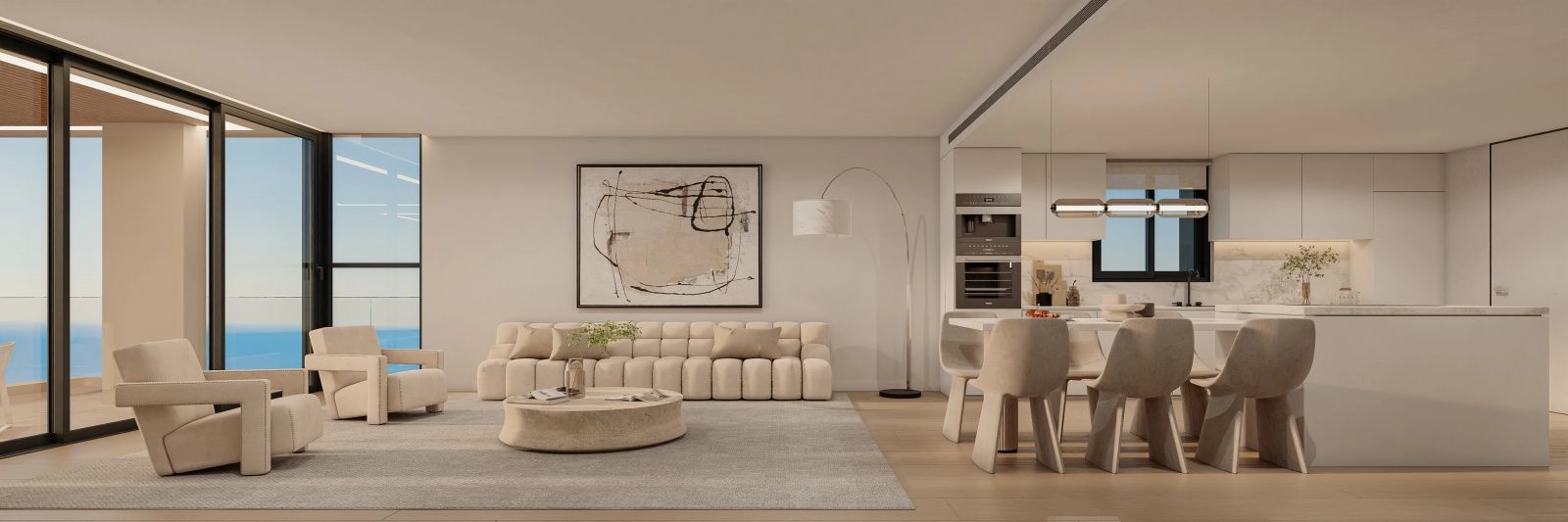 An open-plan living space that seamlessly connects the lounge, dining area, and modern kitchen.