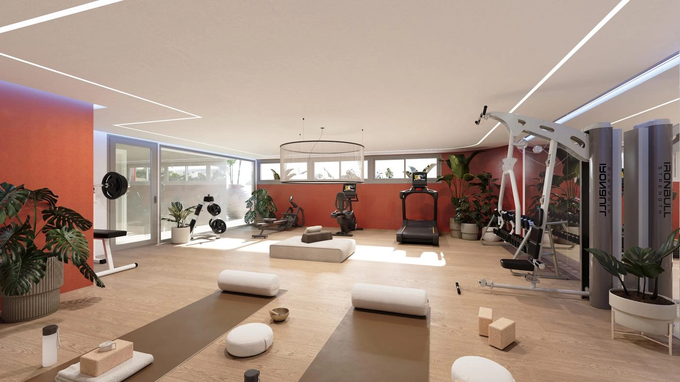 A fully equipped wellness space with a gym and sauna, designed for residents' health and well-being.