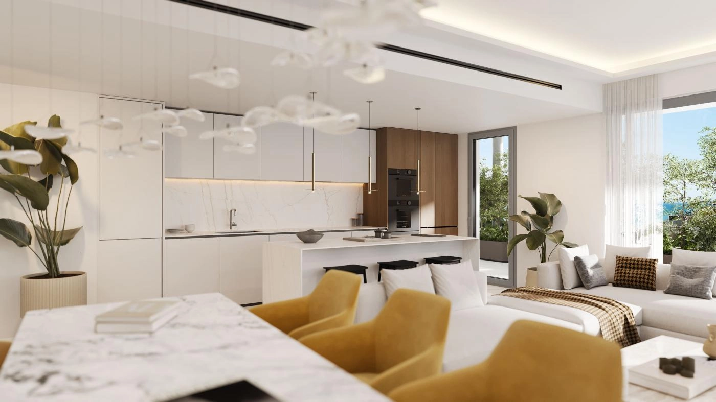 A modern, open-plan kitchen and dining area, ideal for enjoying moments with family and friends.