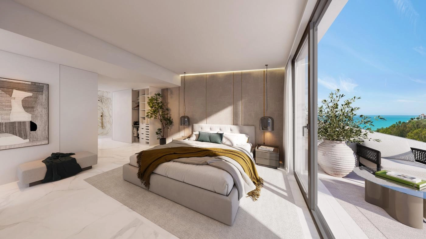 The master bedroom serves as a private retreat, offering direct terrace access and tranquil sea views.