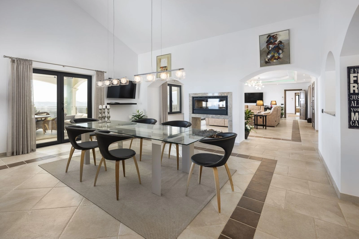 An open-plan dining area that flows seamlessly from the living spaces, perfect for entertaining guests.