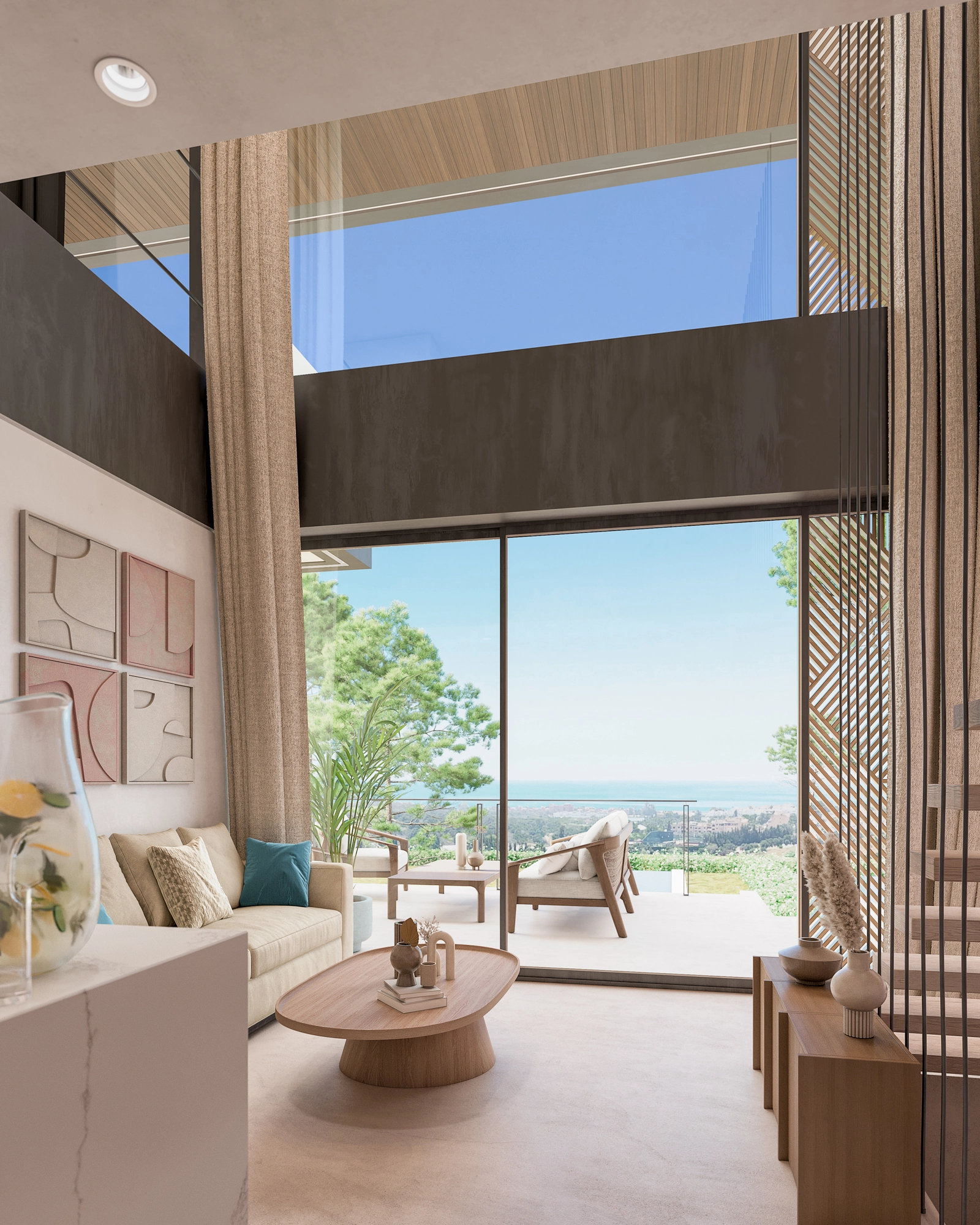 Floor-to-ceiling windows open onto a spacious terrace, revealing beautiful sea views over the Costa del Sol.