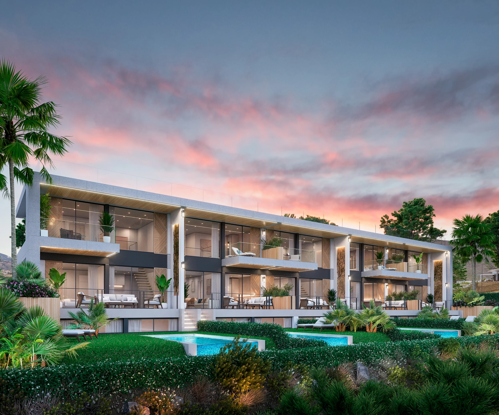 An elegant exterior view showcasing the modern architecture, private terraces, and lush gardens of the development at sunset.