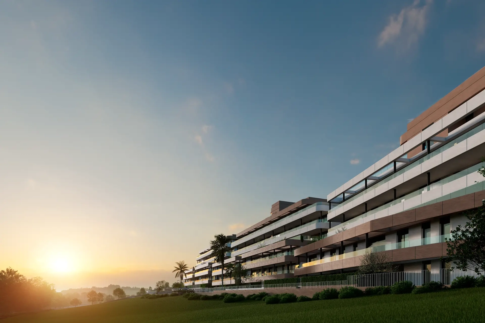 The contemporary architecture of the development glows beautifully during the golden hour of sunset.