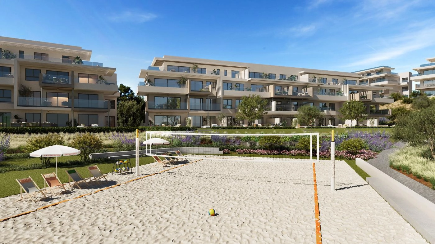 The sand court for beach volleyball or paddle tennis, offering a fun way to stay active and socialize with neighbours.