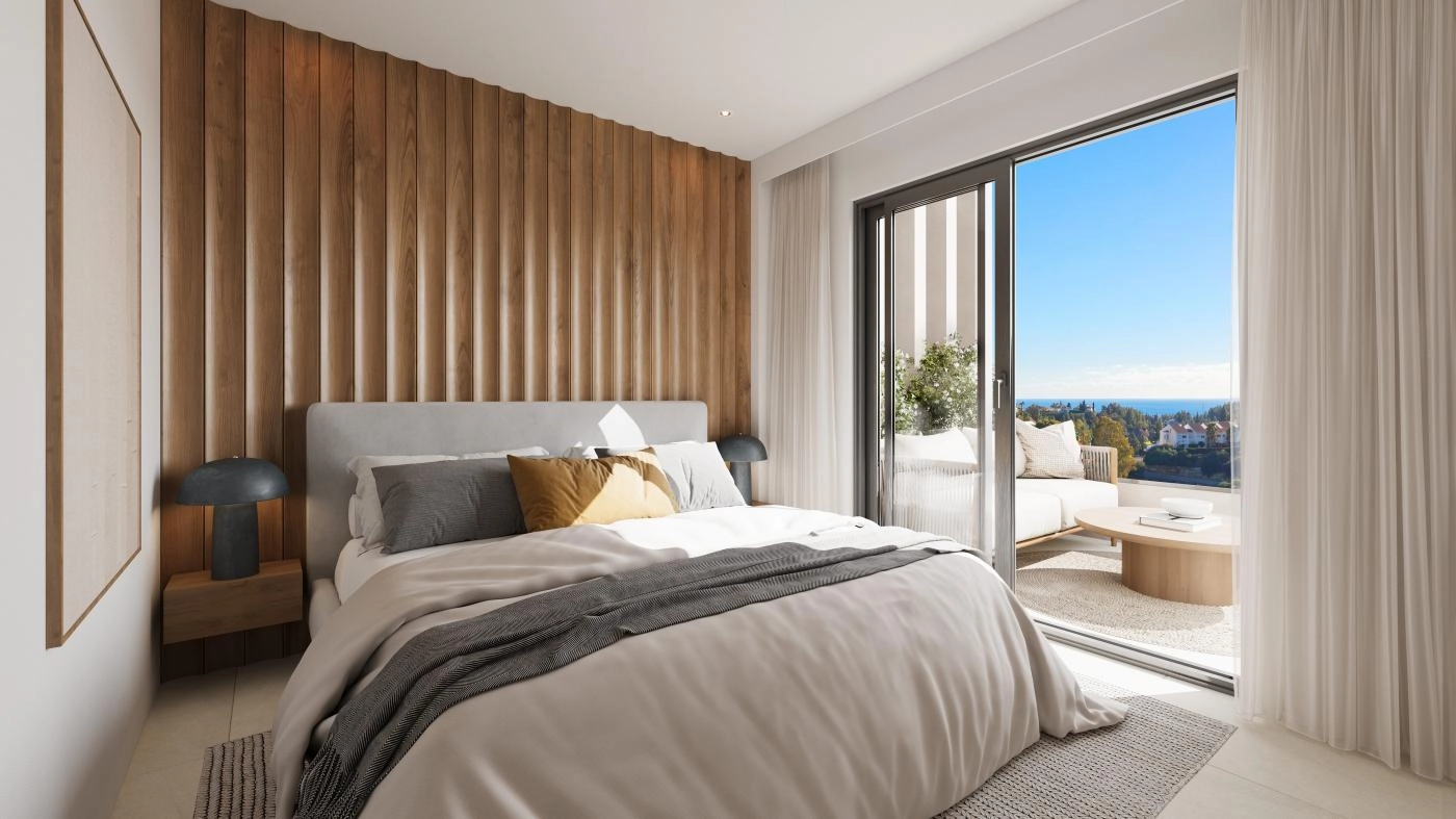 A tranquil master bedroom with direct access to a private terrace, designed to be a peaceful retreat with beautiful natural light.